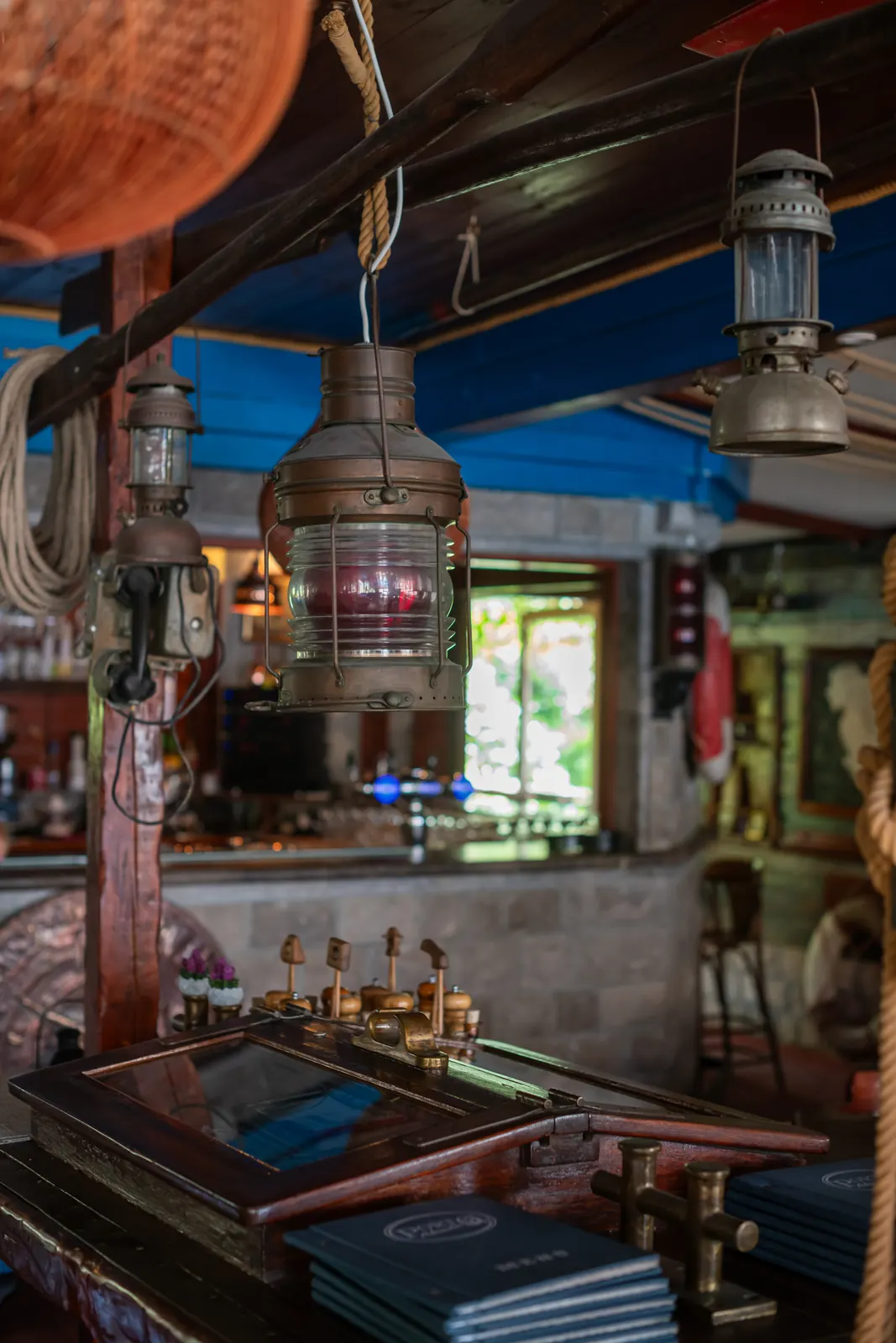 Ship lantern with a red light above the bar