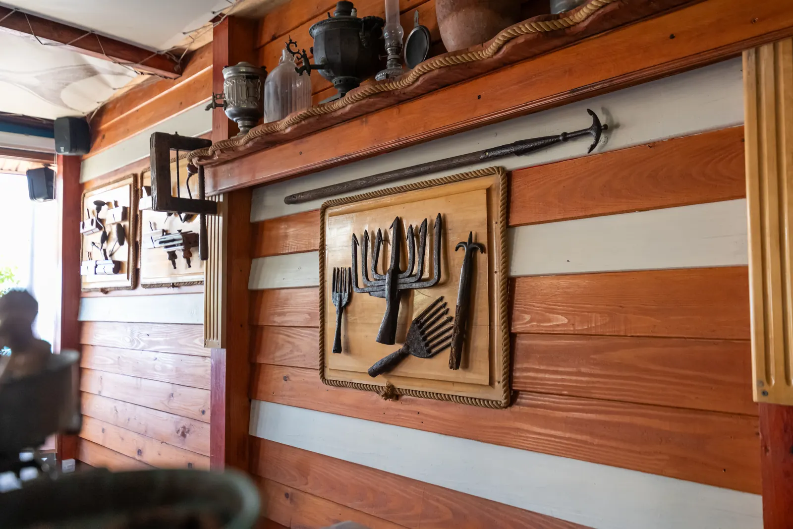 Wooden tools on the wall, tavern decor