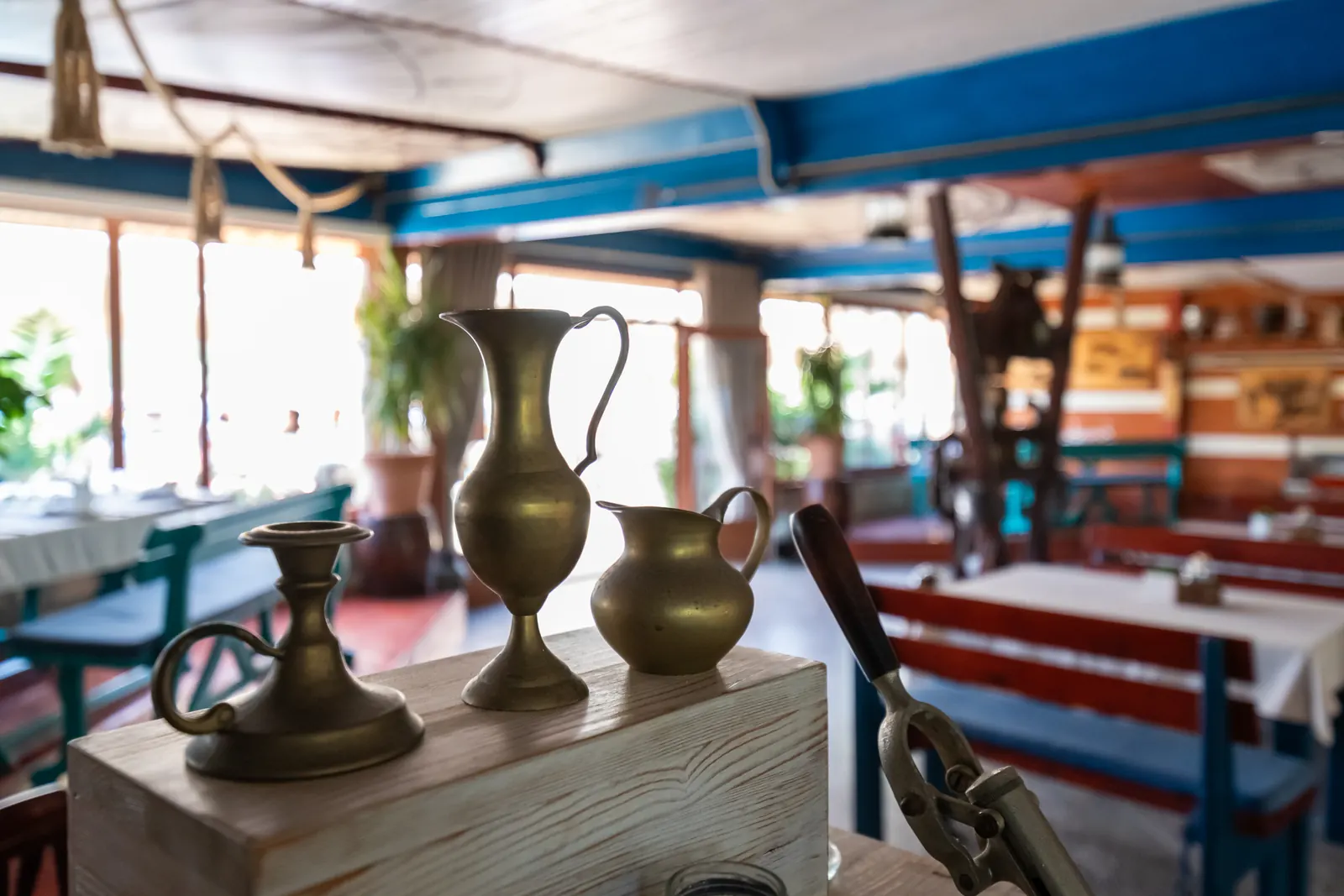 Brass jugs and a candlestick, interior detail
