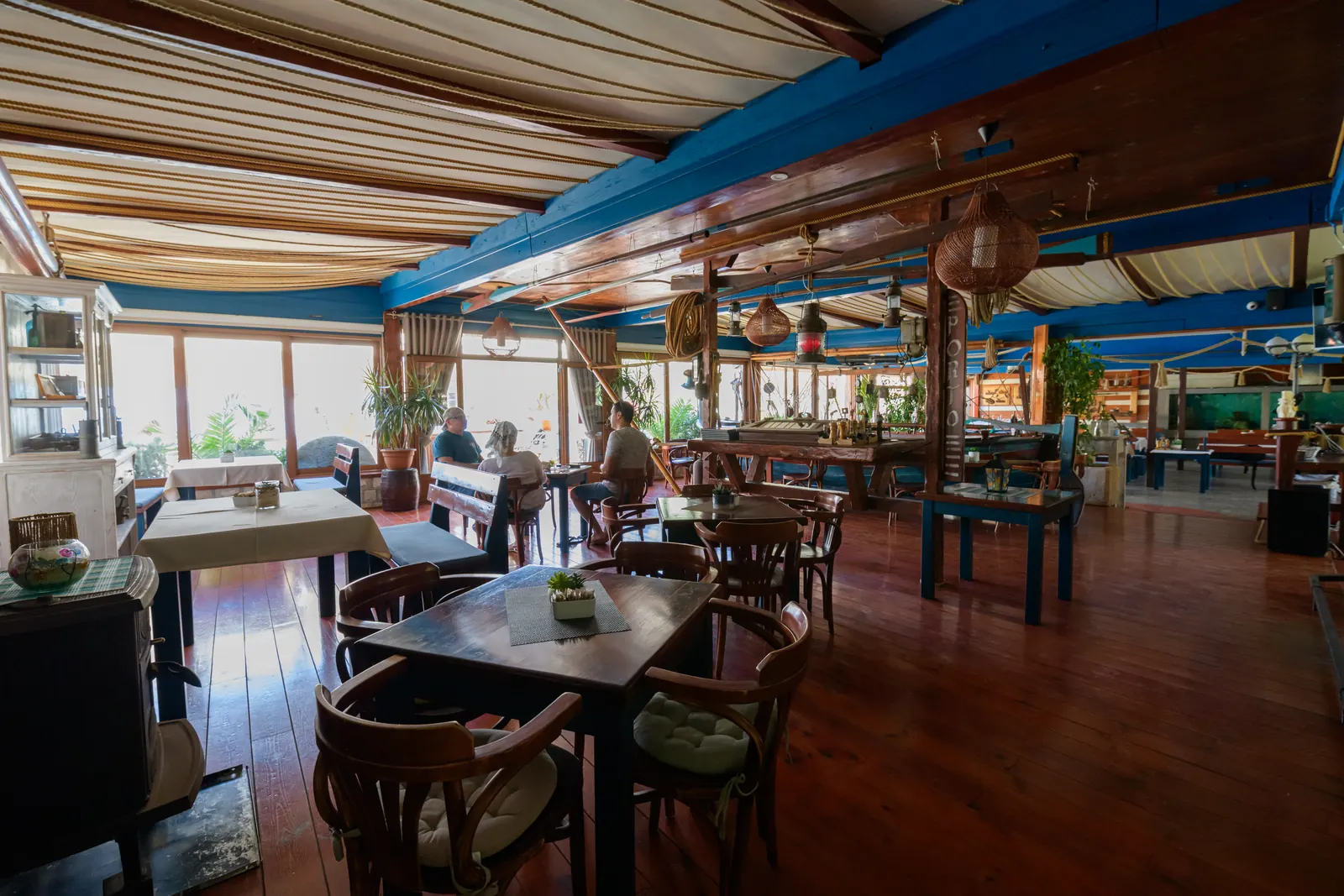 Wood-panelled dining room with a sea view