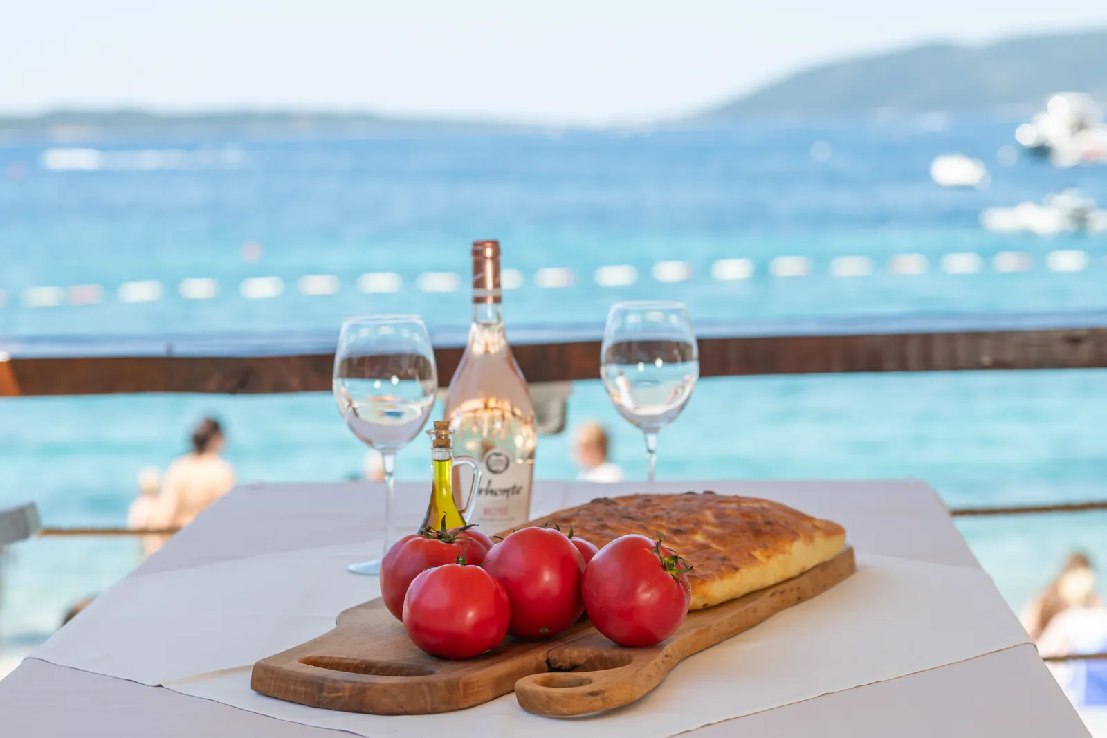 Seaside table with bread and wine