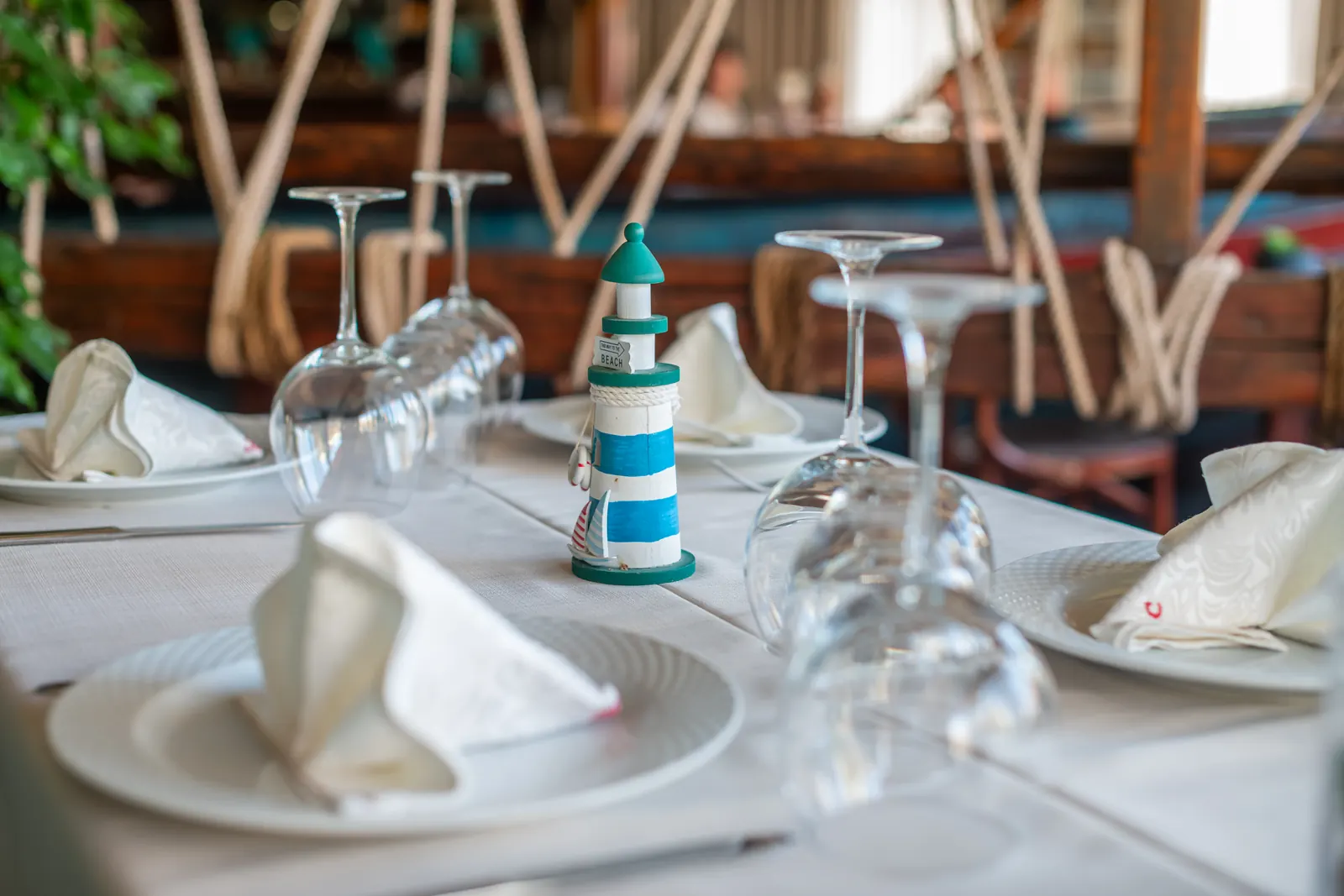 A lighthouse figurine on a set table