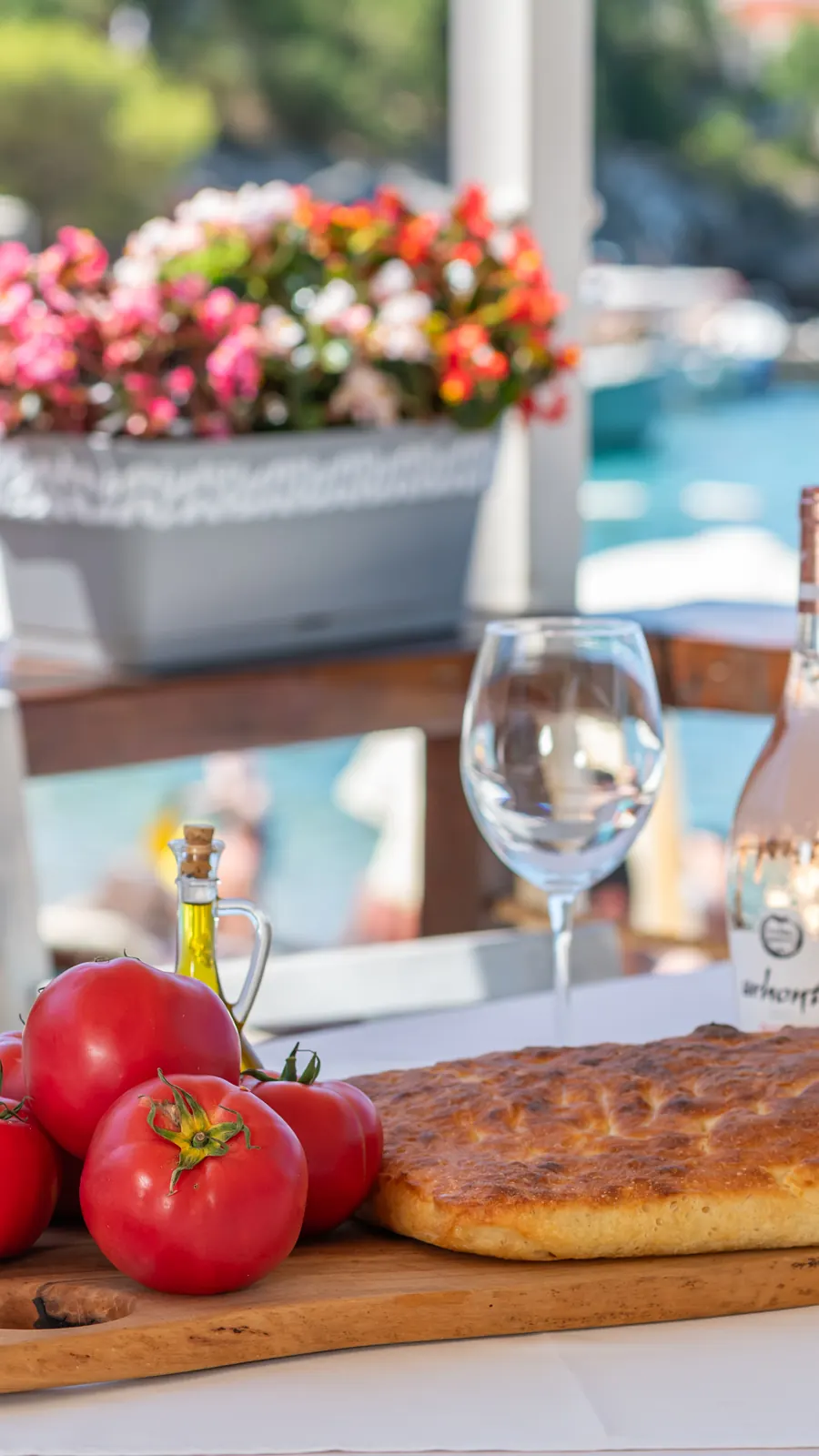 A set table by the sea on Žanjice beach, Porto Adriatic restaurant
